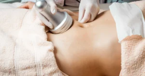 A close-up of a person receiving a non-invasive body contouring treatment on the abdomen in Ashburn, VA