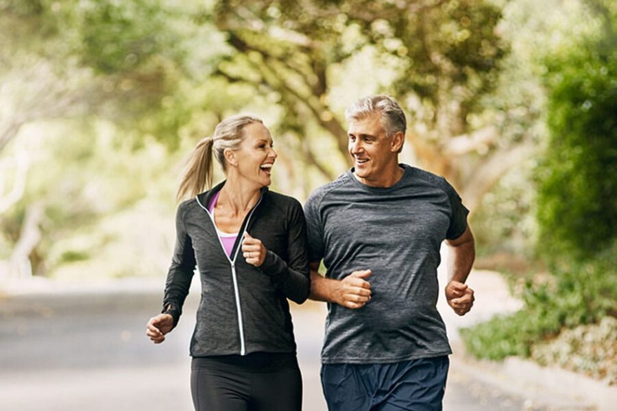 older man and woman running together after getting hormone therapy in Ashburn, VA