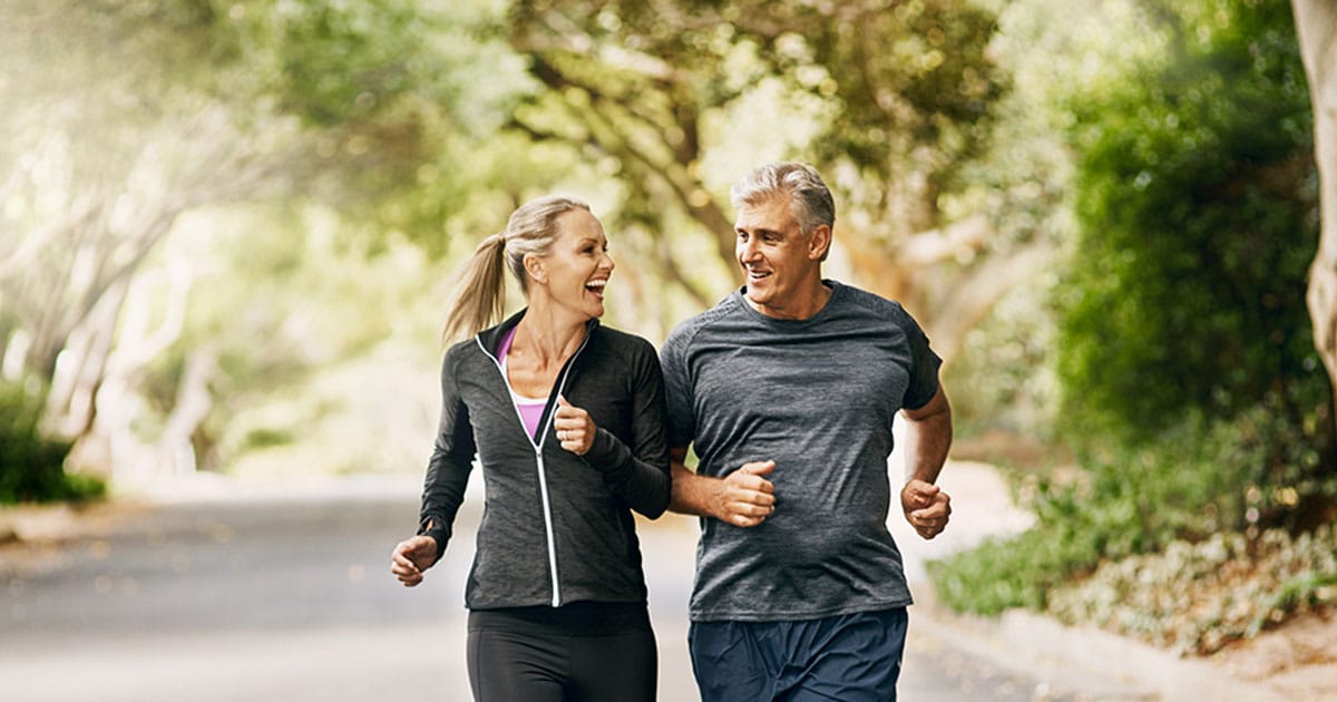 older man and woman running together after getting hormone therapy in Ashburn, VA