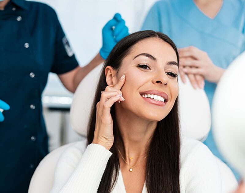 woman smiling after getting botox in Ashburn, VA